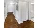Light hallway with wood flooring and built-in storage at 2587 Forest Run Ct # 141B, Clearwater, FL 33761