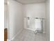 Laundry closet with tile floor and hookups at 2587 Forest Run Ct # 141B, Clearwater, FL 33761