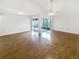 Spacious living room with hardwood floors and access to a patio at 2587 Forest Run Ct # 141B, Clearwater, FL 33761