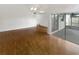Bright living room with hardwood floors and sliding doors to a patio at 2587 Forest Run Ct # 141B, Clearwater, FL 33761