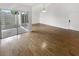 Living room features hardwood floors and access to a screened patio at 2587 Forest Run Ct # 141B, Clearwater, FL 33761
