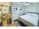 Spacious bedroom with double bed and dresser, plus access to a hallway at 1420 Bayshore Blvd # 316, Dunedin, FL 34698