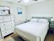Cozy bedroom featuring a double bed and dresser at 1420 Bayshore Blvd # 316, Dunedin, FL 34698