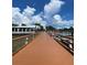 Wooden dock leading to waterfront area at 1420 Bayshore Blvd # 316, Dunedin, FL 34698