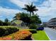 Landscaped entrance with fountain and tropical plants at 1420 Bayshore Blvd # 316, Dunedin, FL 34698