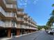 Multi-story building with parking and balconies at 1420 Bayshore Blvd # 316, Dunedin, FL 34698