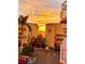 Two-story building with sunset view and palm trees at 1420 Bayshore Blvd # 316, Dunedin, FL 34698