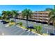 Two-story condo building with parking and tropical landscaping at 1420 Bayshore Blvd # 316, Dunedin, FL 34698