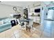Bright kitchenette with white cabinets, microwave, and two-burner cooktop at 1420 Bayshore Blvd # 316, Dunedin, FL 34698