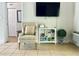 Living room features comfy armchair and flat-screen TV at 1420 Bayshore Blvd # 316, Dunedin, FL 34698