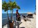 Waterfront patio with seating and pirate statue at 1420 Bayshore Blvd # 316, Dunedin, FL 34698