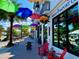 Vibrant streetscape with colorful umbrellas and shops at 1420 Bayshore Blvd # 316, Dunedin, FL 34698