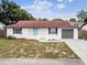 Newly renovated single-story home with a modern facade and attractive landscaping at 8540 Zane Ln, Port Richey, FL 34668