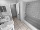 Clean bathroom with double vanity and tub shower combo at 6826 San Jose Loop, New Port Richey, FL 34655