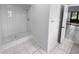 Clean bathroom with shower and tiled walls at 6826 San Jose Loop, New Port Richey, FL 34655