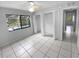 Bedroom with tile floors, double closets, and pool view at 6826 San Jose Loop, New Port Richey, FL 34655