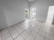 Bright bedroom with tile floors and access to bathroom at 6826 San Jose Loop, New Port Richey, FL 34655