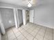 Bedroom with double closets and tile floors at 6826 San Jose Loop, New Port Richey, FL 34655