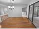 Spacious dining area with hardwood floors and view of kitchen at 6826 San Jose Loop, New Port Richey, FL 34655