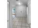 Bright entryway with tile floors and double doors at 6826 San Jose Loop, New Port Richey, FL 34655