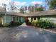 House exterior with a large yard and a paved driveway at 6826 San Jose Loop, New Port Richey, FL 34655