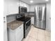 Updated kitchen, featuring granite countertops and stainless steel appliances at 6826 San Jose Loop, New Port Richey, FL 34655