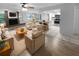 Open living area with kitchen island, fireplace, and new floors at 6826 San Jose Loop, New Port Richey, FL 34655