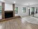Living room featuring a brick fireplace and tile flooring at 6826 San Jose Loop, New Port Richey, FL 34655