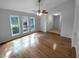 Spacious living room with hardwood floors and large windows at 6826 San Jose Loop, New Port Richey, FL 34655