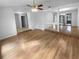 Bright living room with hardwood floors and access to other rooms at 6826 San Jose Loop, New Port Richey, FL 34655