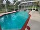 Inviting screened pool with spa and ample deck space at 6826 San Jose Loop, New Port Richey, FL 34655