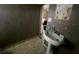 A small bathroom with a pedestal sink and needs cosmetic updates at 16211 3Rd E St, Redington Beach, FL 33708