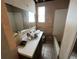 Bathroom with a bathtub, sink, and mirror at 16211 3Rd E St, Redington Beach, FL 33708