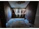 A bedroom with dark patterned wallpaper and a ceiling fan at 16211 3Rd E St, Redington Beach, FL 33708