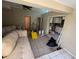 Living room with open concept to kitchen, needs updating at 16211 3Rd E St, Redington Beach, FL 33708