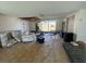Living room with damaged ceiling and water damage at 16211 3Rd E St, Redington Beach, FL 33708