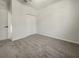 Second bedroom with neutral carpeting and double door closet at 3105 46Th E St, Palmetto, FL 34221