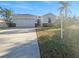 Single-story home with a two-car garage and landscaped yard at 3105 46Th E St, Palmetto, FL 34221