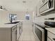 Modern kitchen with stainless steel appliances and an eat-in island at 3105 46Th E St, Palmetto, FL 34221