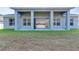 Covered patio with folding doors leading to the kitchen at 3989 Cincinnati St, North Port, FL 34286