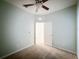 Simple bedroom with ceiling fan and carpet flooring at 1403 Custer Bayou St, Ruskin, FL 33570