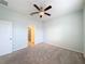 Spacious bedroom with ceiling fan and en-suite bathroom access at 1403 Custer Bayou St, Ruskin, FL 33570