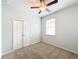 Spacious bedroom with ceiling fan and carpet flooring at 1403 Custer Bayou St, Ruskin, FL 33570