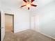 Spacious bedroom with ceiling fan and carpet flooring at 1403 Custer Bayou St, Ruskin, FL 33570