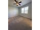 Spacious bedroom with carpet flooring and ceiling fan at 1403 Custer Bayou St, Ruskin, FL 33570