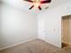 Well-lit bedroom with ceiling fan and neutral decor at 1403 Custer Bayou St, Ruskin, FL 33570