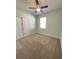 Bedroom with double door closet and ceiling fan at 1403 Custer Bayou St, Ruskin, FL 33570