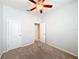 Bright bedroom featuring ceiling fan and neutral walls at 1403 Custer Bayou St, Ruskin, FL 33570