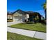 One-story home with attached garage and well-manicured lawn at 1403 Custer Bayou St, Ruskin, FL 33570