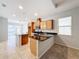 Kitchen features island, stainless steel appliances, and granite countertops at 1403 Custer Bayou St, Ruskin, FL 33570